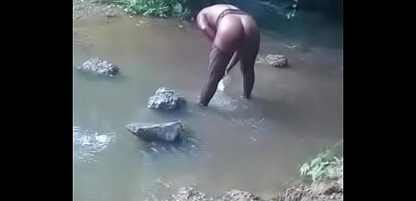  hot african woman taking bath